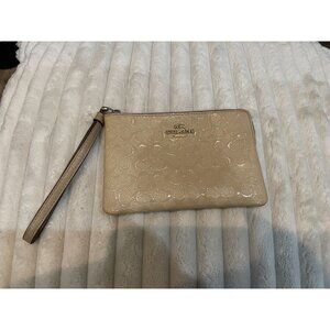 B305 -  Coach Signature Embossed Patent Leather Corner Zip Wristlet in a beige/c